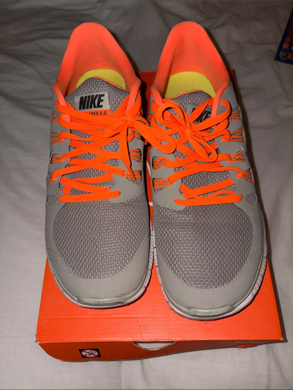 Nike Gray Sneakers with Bright Orange Accents